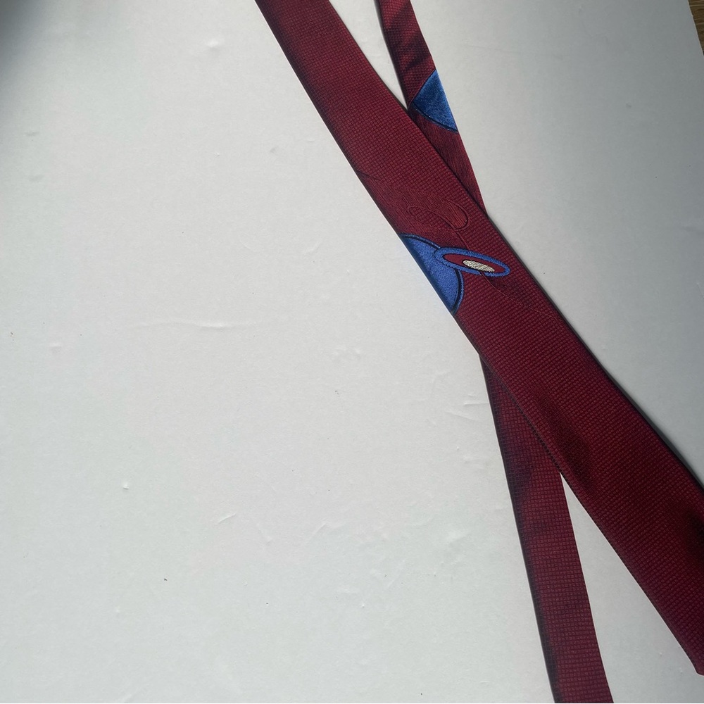 Men’s Bonjour skinny necktie. Red with blue design. Color changing in sunlight.